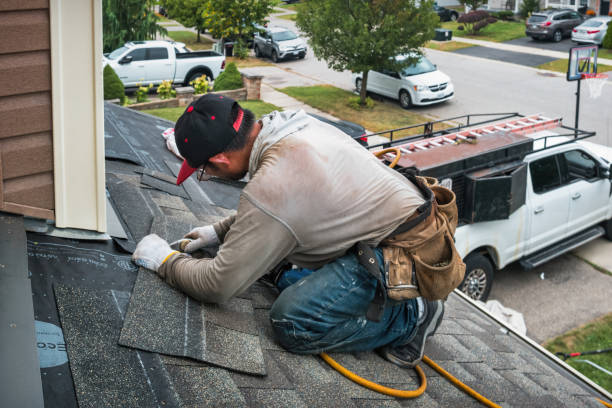 Professional Roofing technician working in West Henrietta, NY
